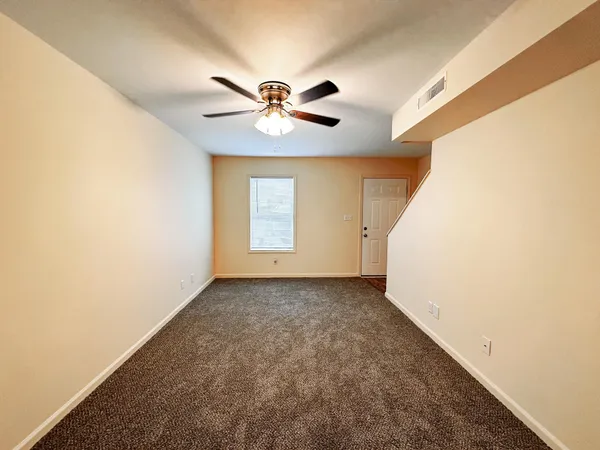 a view of a big room with carpet