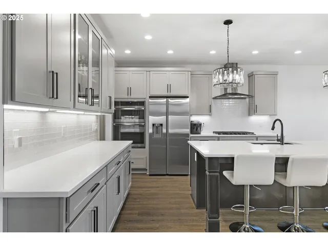 a kitchen with kitchen island granite countertop a sink and counter space