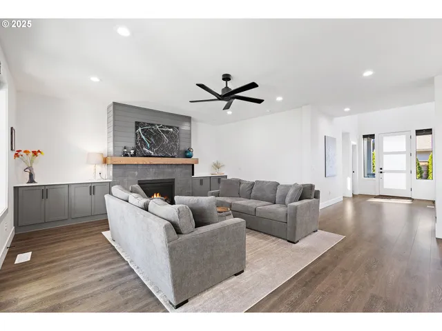 a living room with furniture and a fireplace