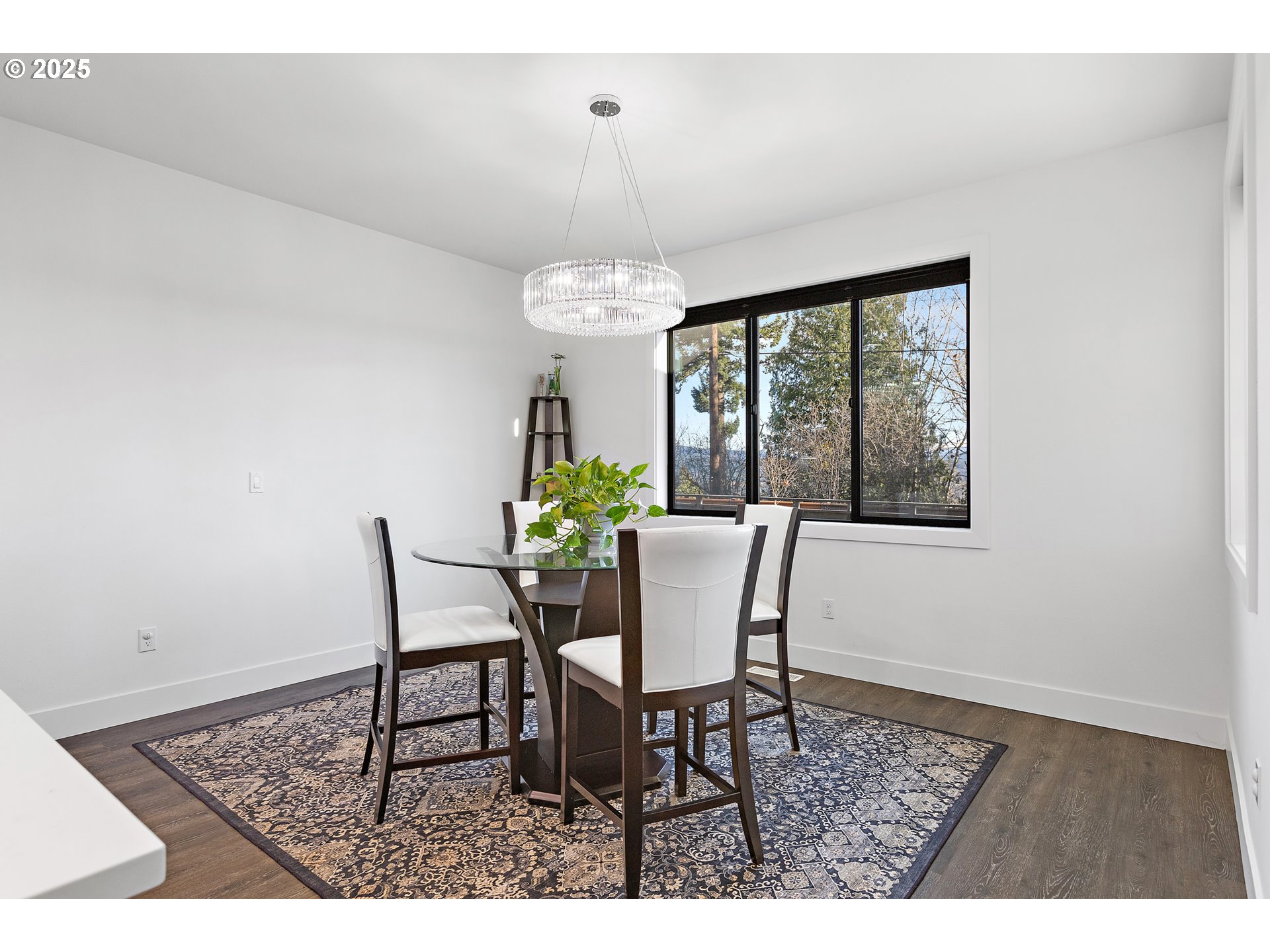 37802 Southeast Olson Street Sandy, OR 97055 - Photo 15 of 48 a dining room with furniture a rug and a chandelier