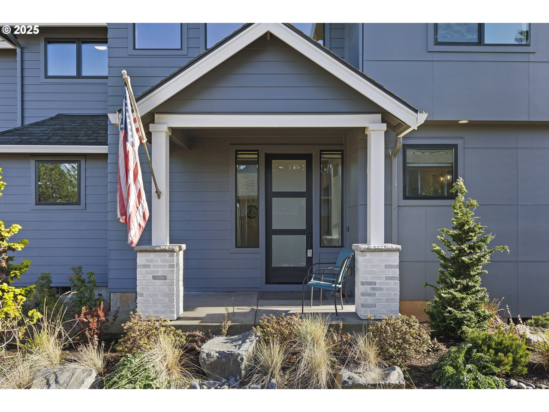 37802 Southeast Olson Street Sandy, OR 97055 - Photo 2 of 48 a front view of a house with garden