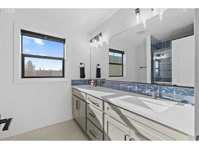 a bathroom with a sink double vanity and a granite