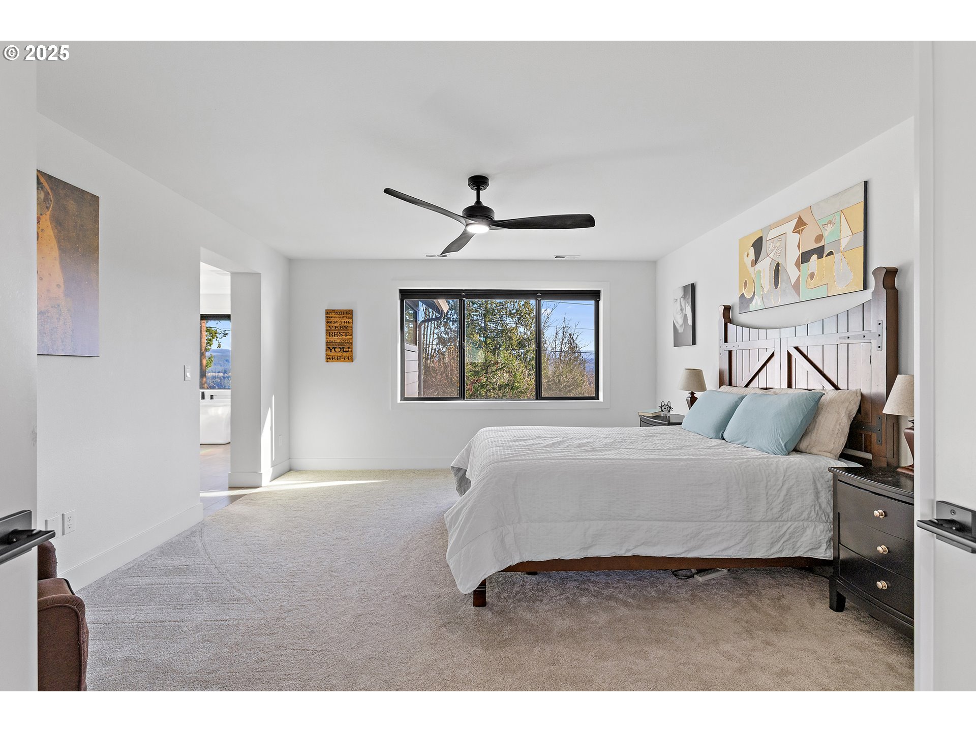 37802 Southeast Olson Street Sandy, OR 97055 - Photo 29 of 48 a bedroom with a large bed and a window