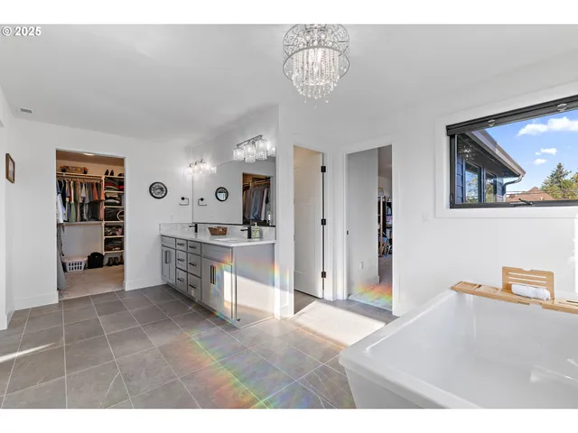 a kitchen with stainless steel appliances kitchen island a refrigerator and cabinets