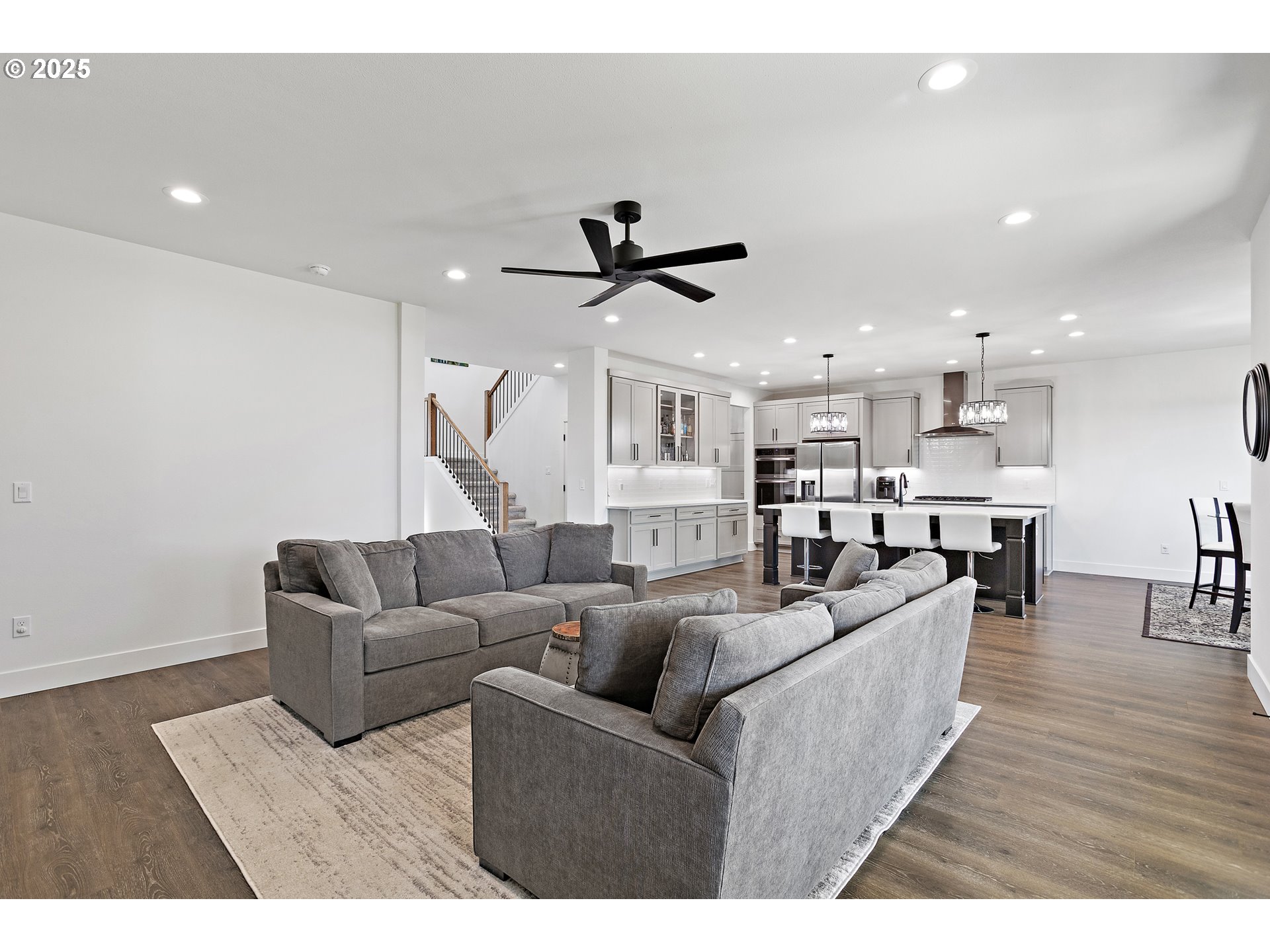 37802 Southeast Olson Street Sandy, OR 97055 - Photo 9 of 48 a living room with furniture kitchen view and a wooden floor