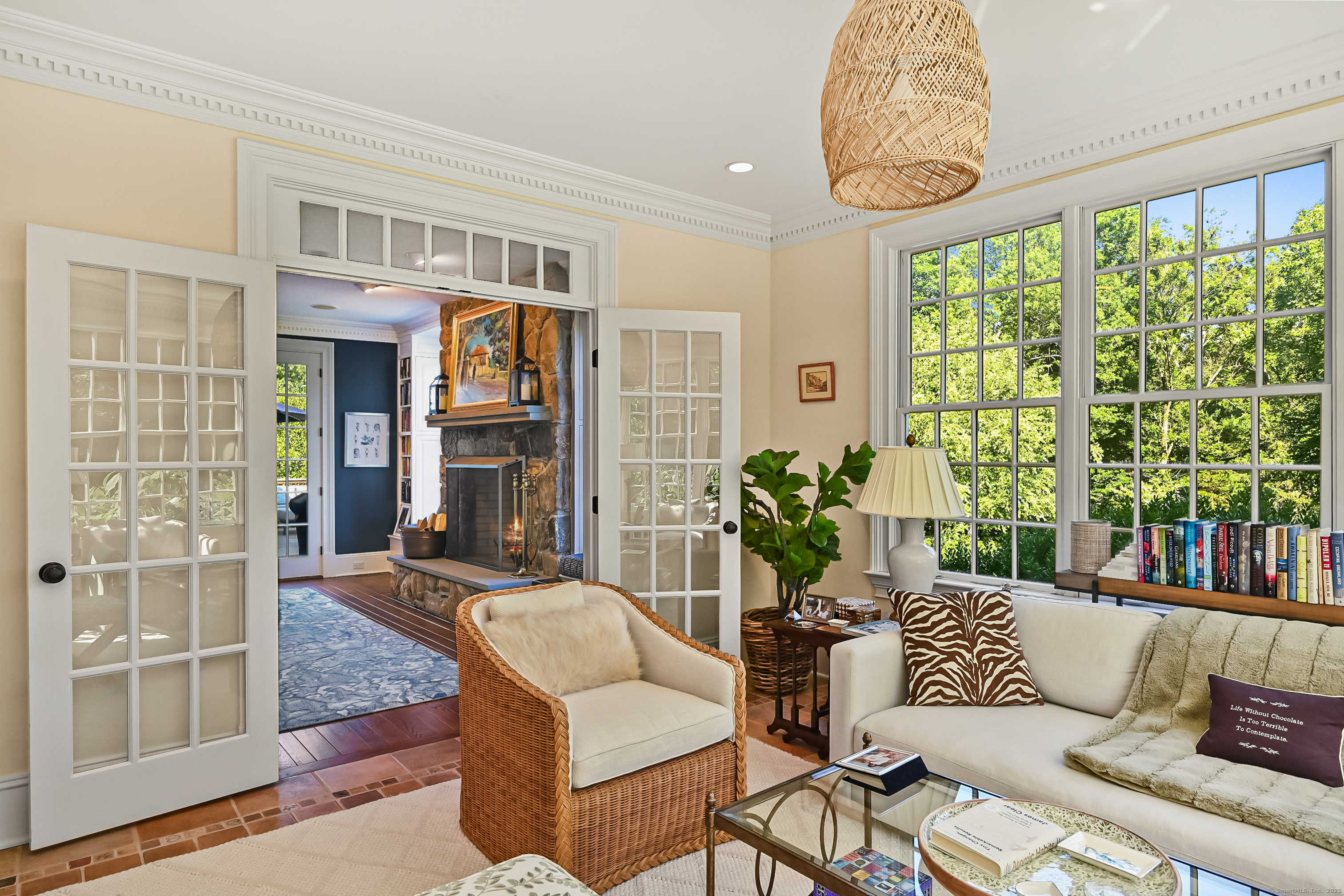 1084 Sturges Highway Fairfield, CT 06880 - Photo 16 of 40 a living room with fireplace furniture and a large window