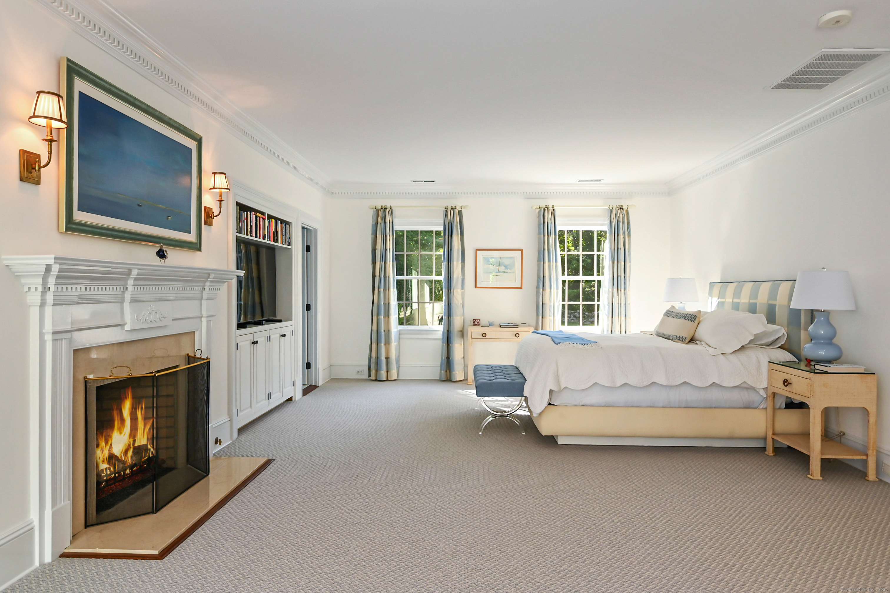 1084 Sturges Highway Fairfield, CT 06880 - Photo 18 of 40 a spacious bedroom with a bed fireplace and window