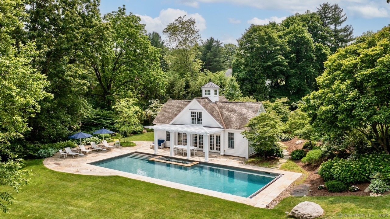 1084 Sturges Highway Fairfield, CT 06880 - Photo 2 of 40 a view of a house with swimming pool and sitting area
