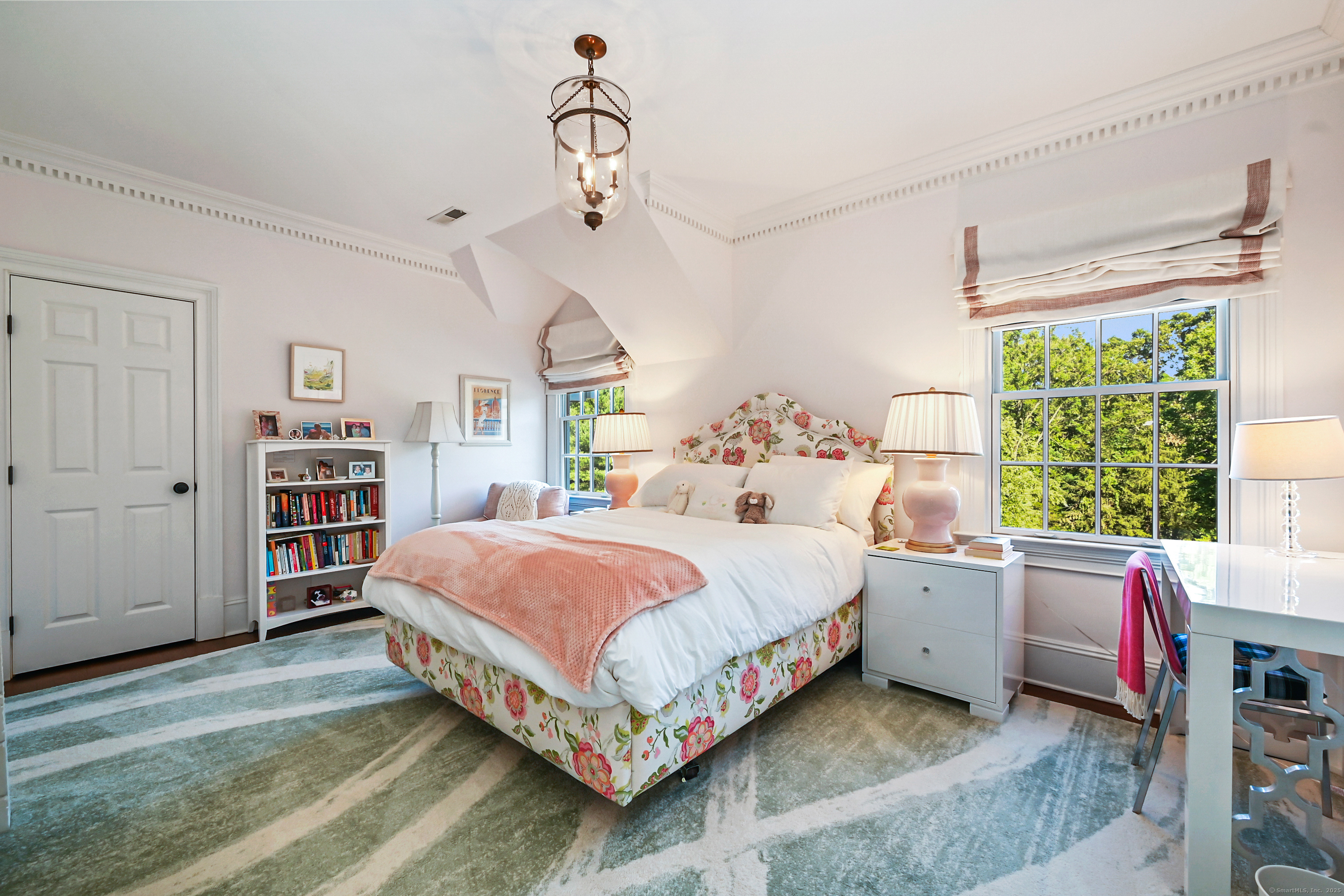 1084 Sturges Highway Fairfield, CT 06880 - Photo 21 of 40 a bedroom with a bed wooden floor and window