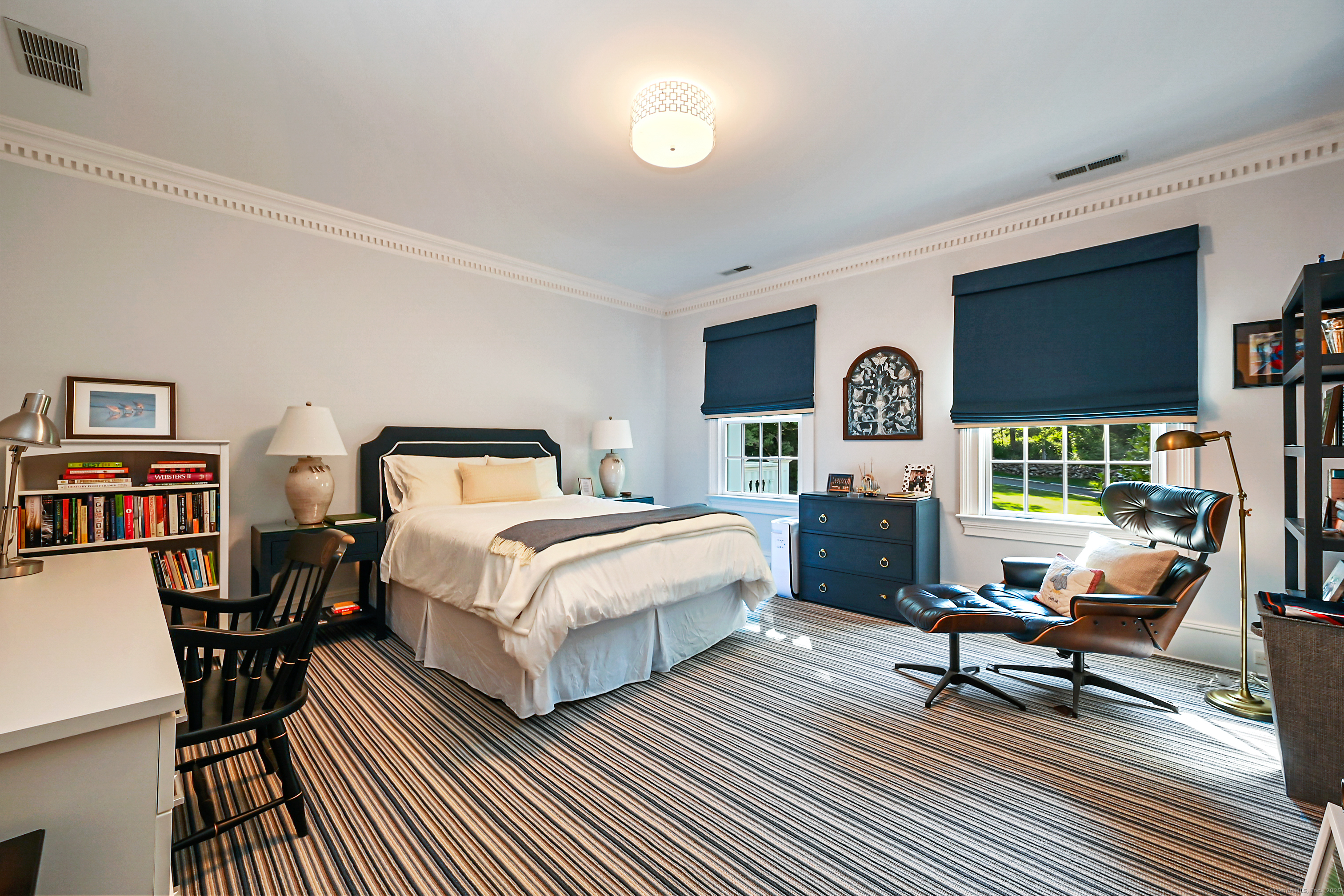 1084 Sturges Highway Fairfield, CT 06880 - Photo 22 of 40 a bedroom with a bed a table and chair