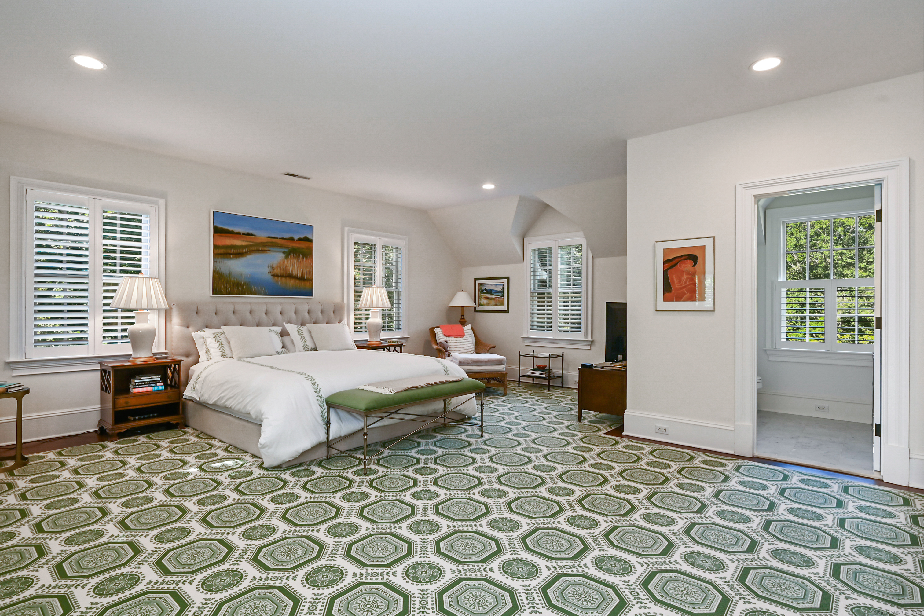 1084 Sturges Highway Fairfield, CT 06880 - Photo 24 of 40 a bedroom with a bed and wooden floor