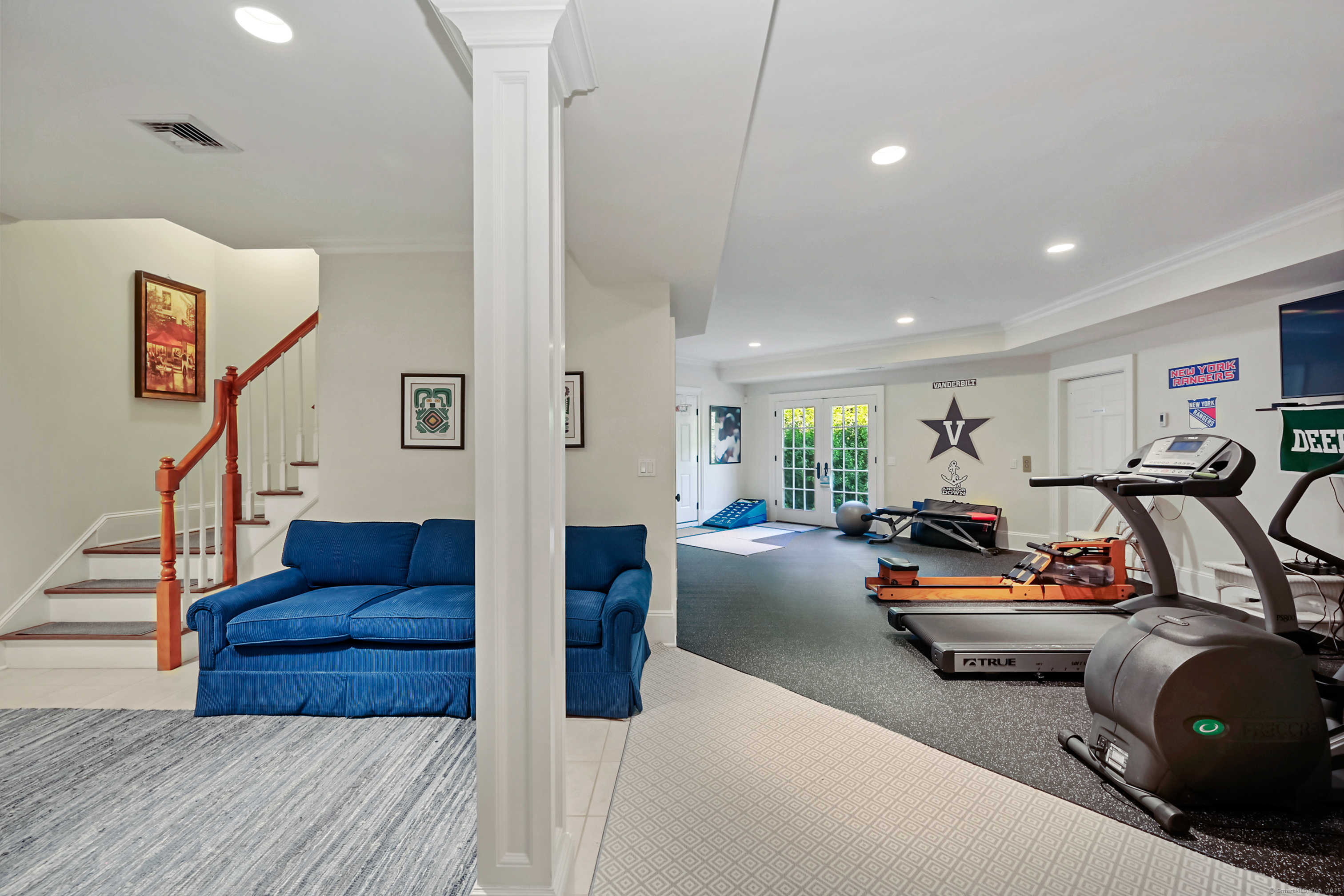 1084 Sturges Highway Fairfield, CT 06880 - Photo 25 of 40 a living room with furniture gym equipment and a view of living room