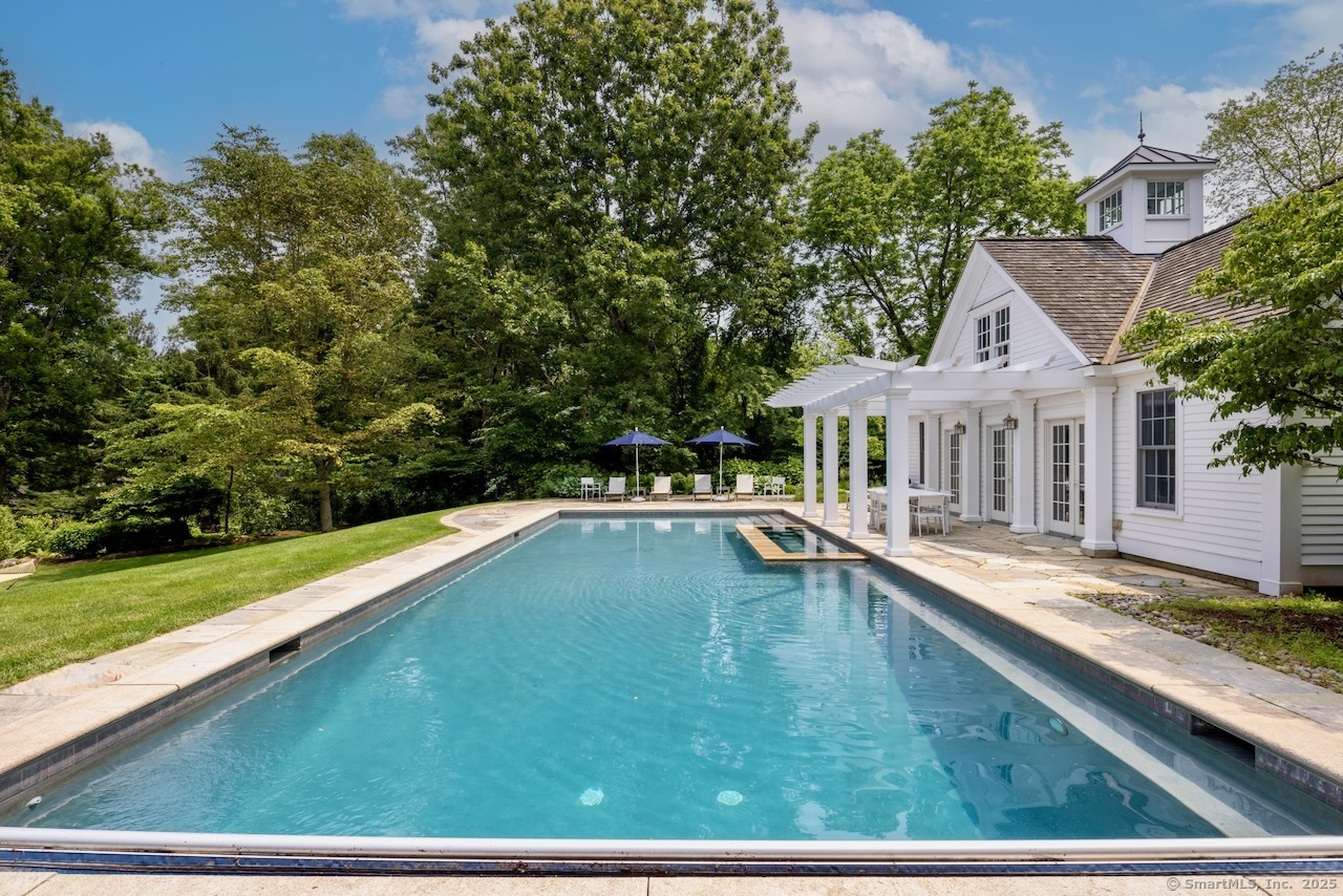 1084 Sturges Highway Fairfield, CT 06880 - Photo 28 of 40 a house with swimming pool in front of it