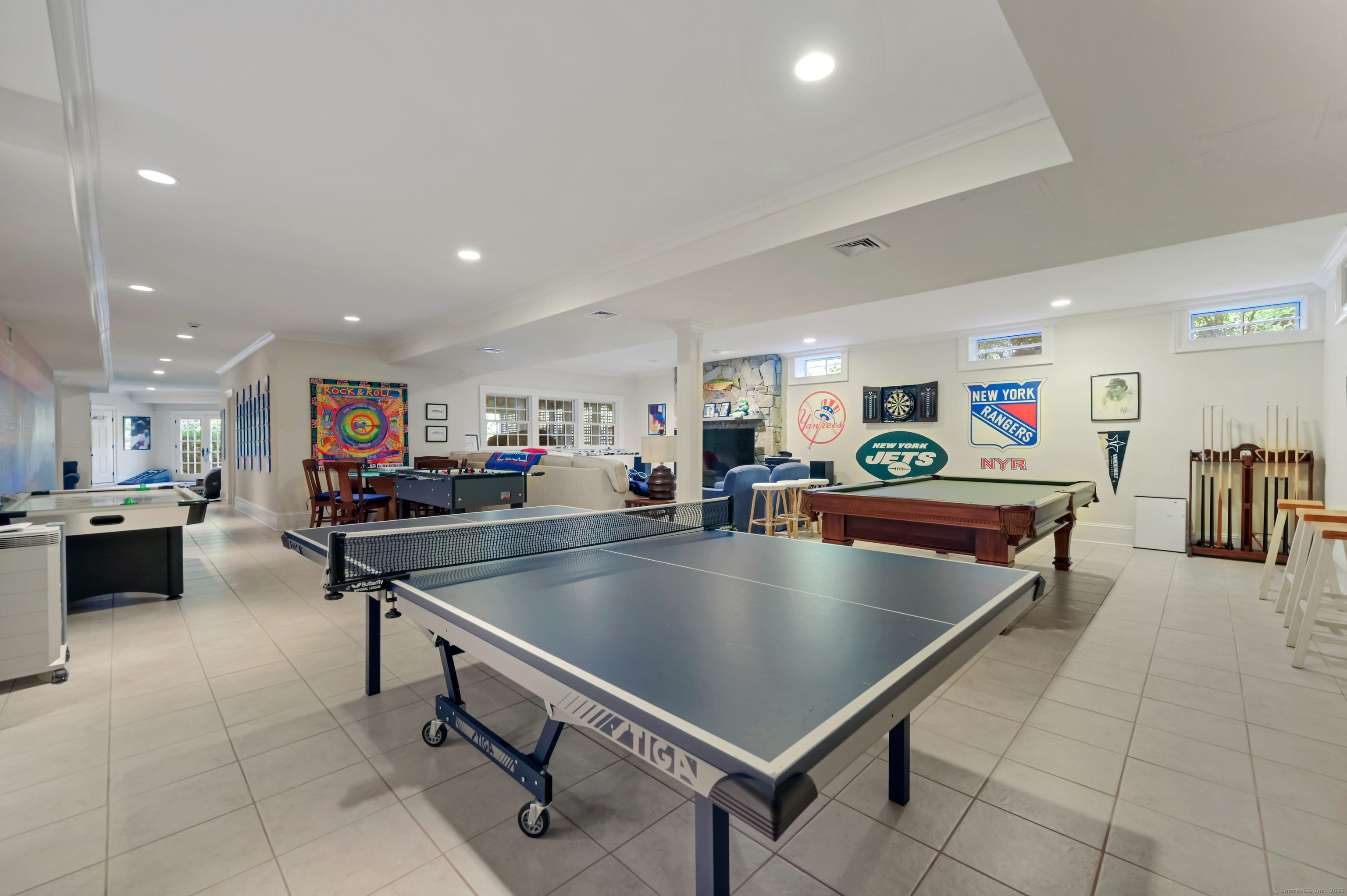 1084 Sturges Highway Fairfield, CT 06880 - Photo 30 of 40 a room with table tennis and stairs