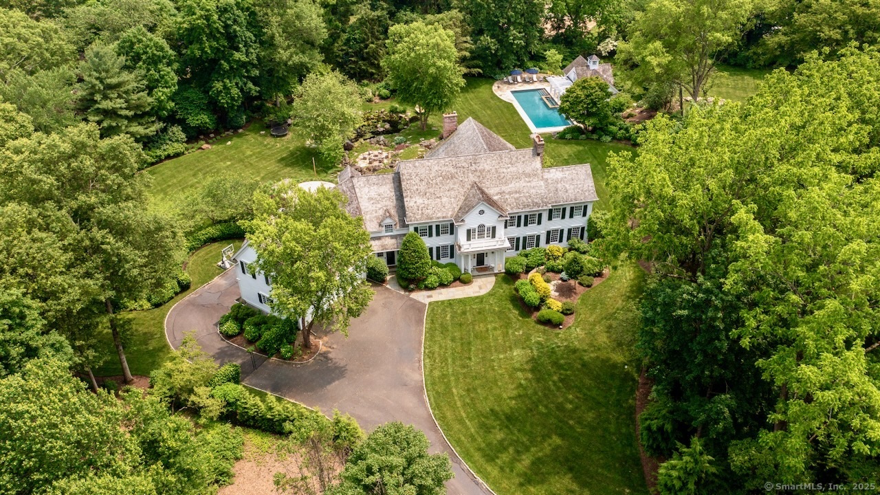 1084 Sturges Highway Fairfield, CT 06880 - Photo 32 of 40 a view of a house with a yard and garden