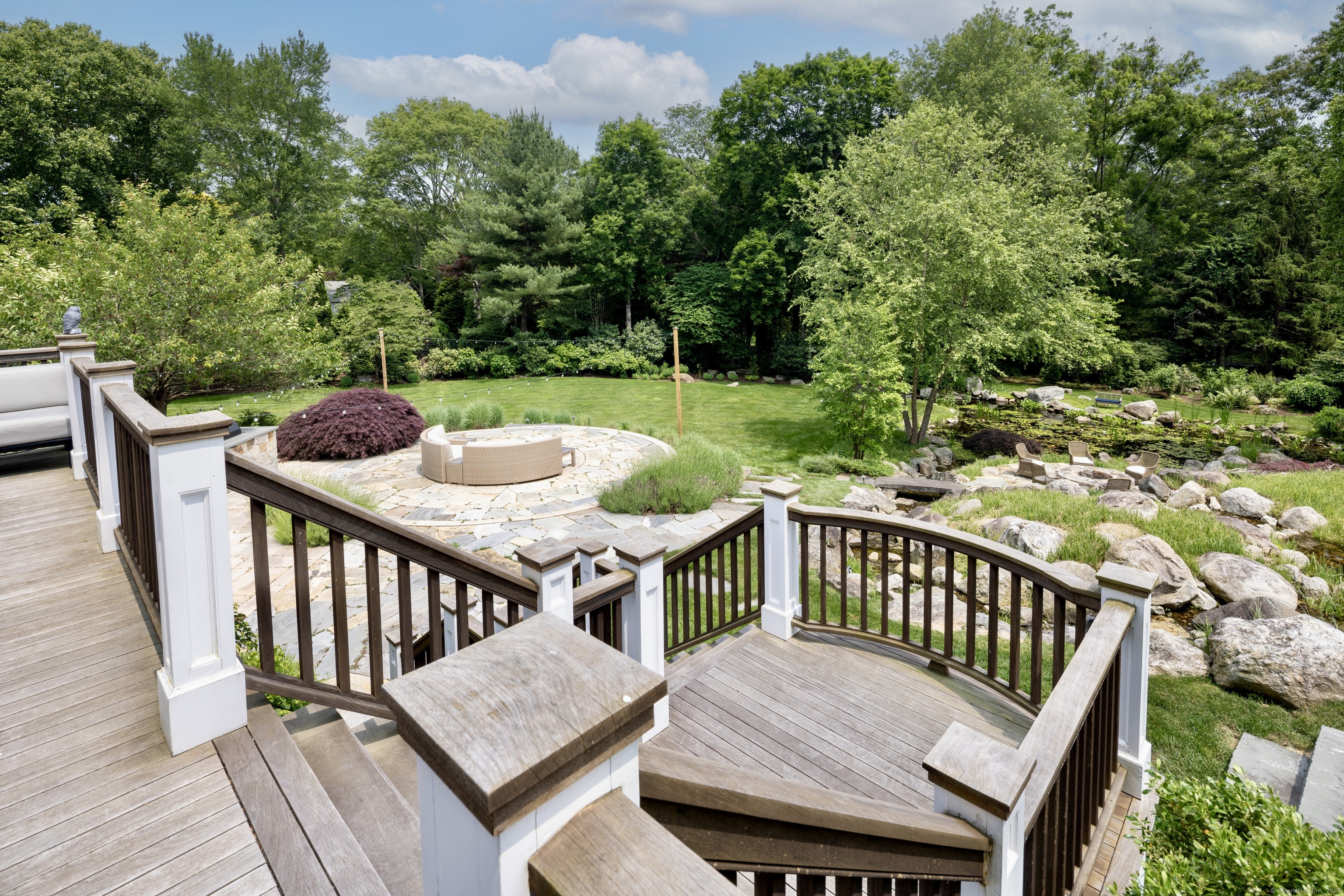 1084 Sturges Highway Fairfield, CT 06880 - Photo 36 of 40 a view of balcony with wooden floor and outdoor seating