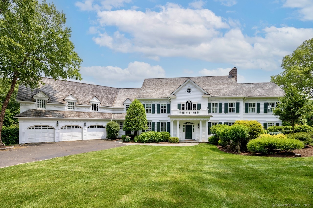1084 Sturges Highway Fairfield, CT 06880 - Photo 37 of 40 a front view of a house with a garden