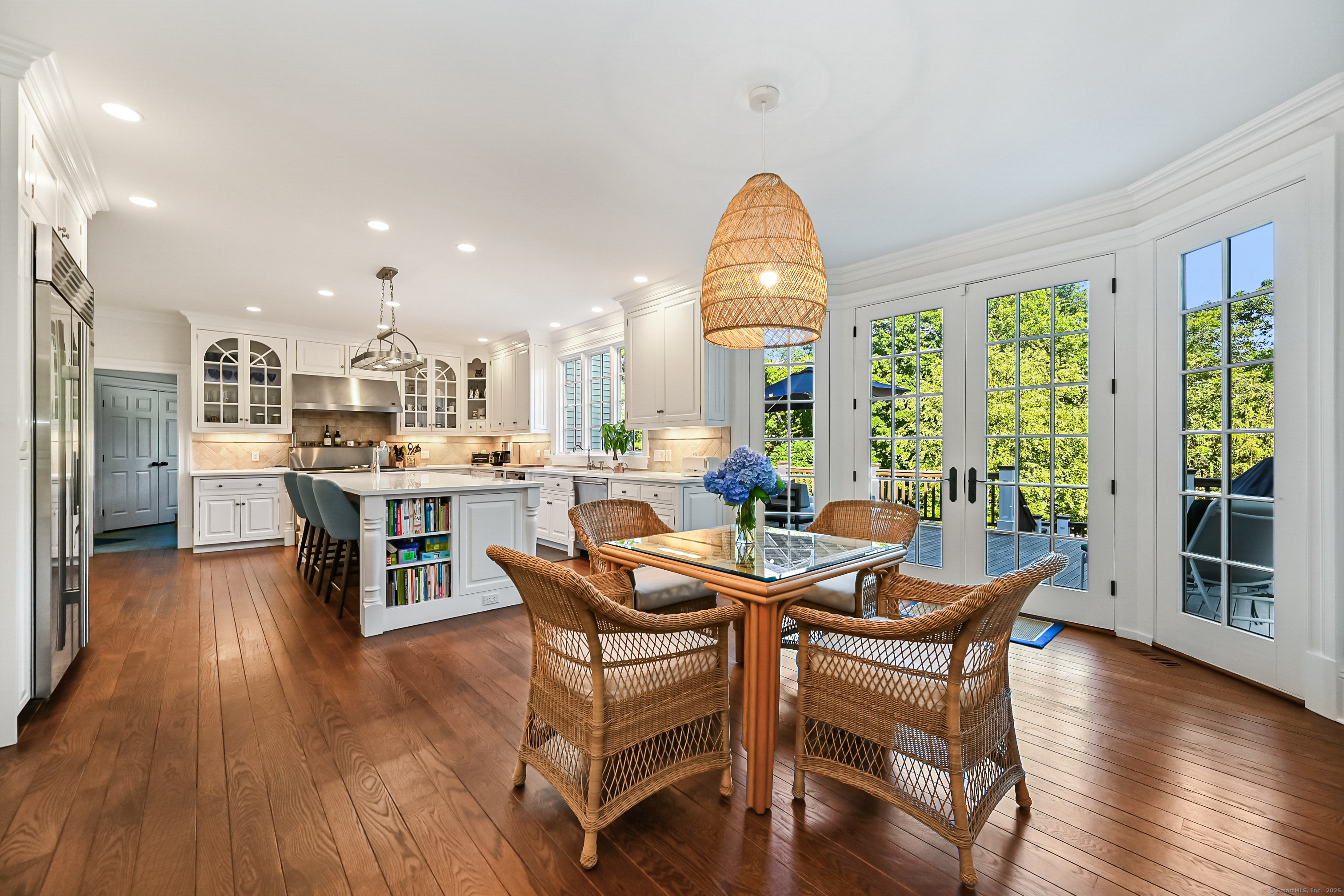 1084 Sturges Highway Fairfield, CT 06880 - Photo 10 of 40 a view of a dining room with furniture window and wooden floor
