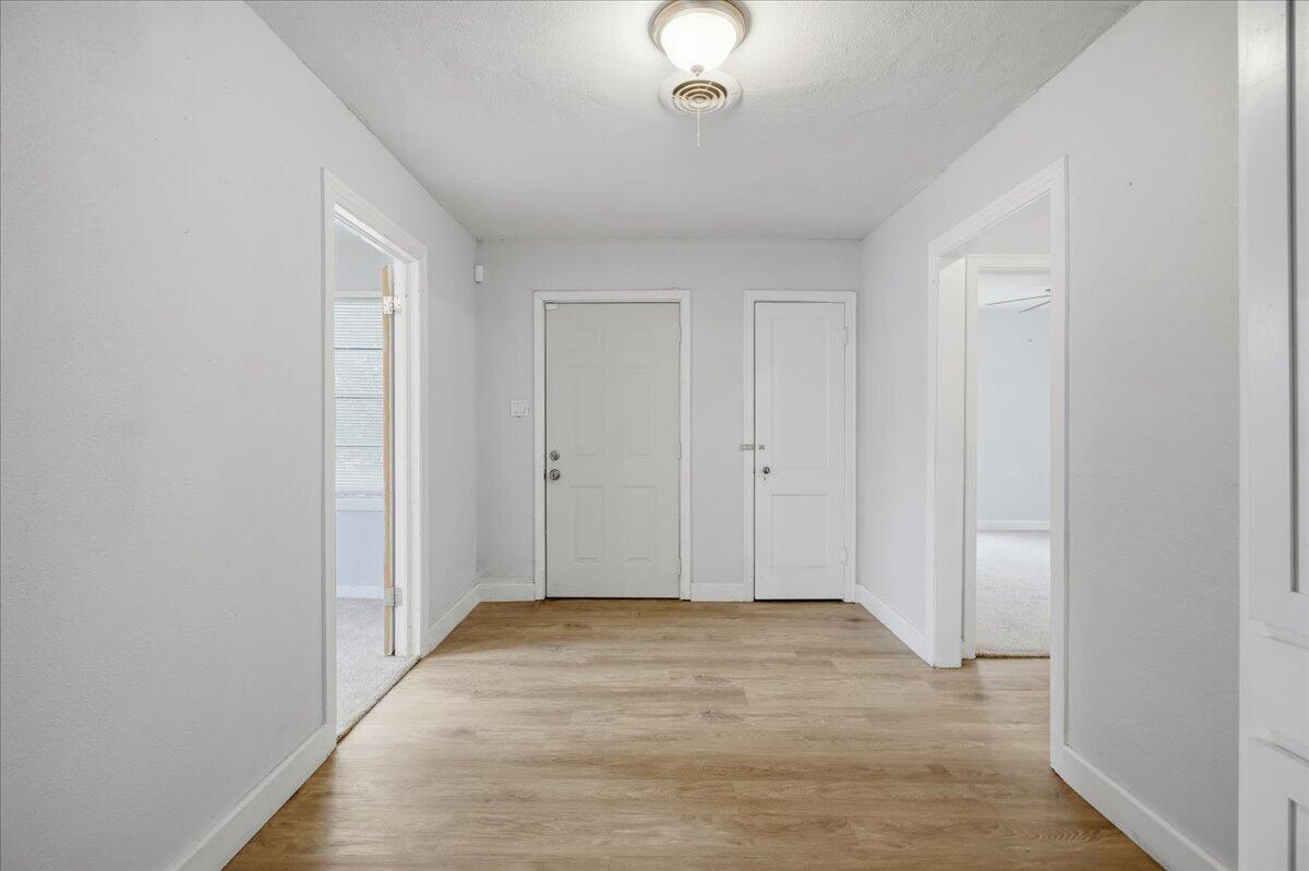 2503 30th Street Lubbock, TX 79410 - Photo 12 of 26 a view of an empty room with wooden floor