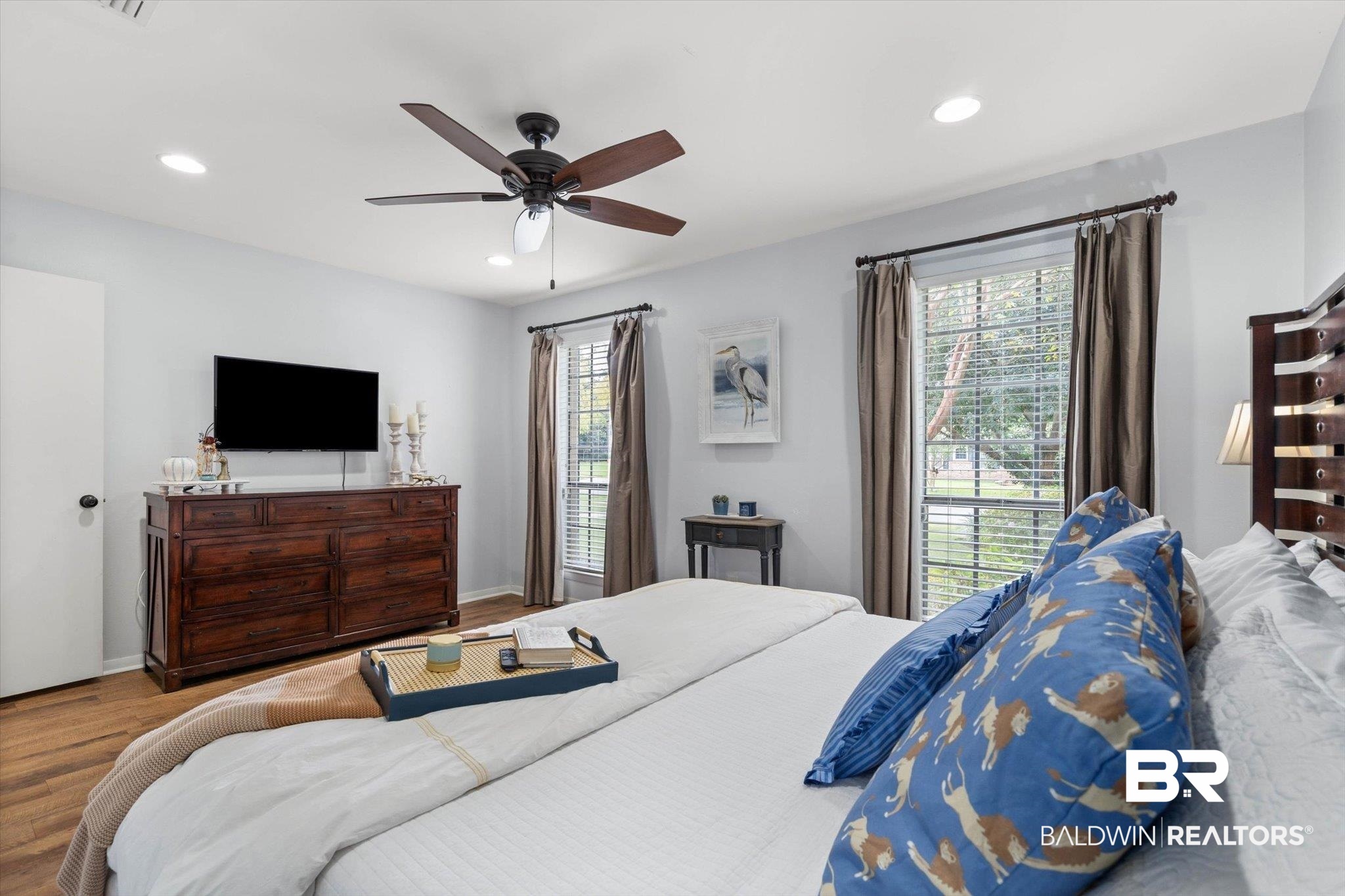 254 Woodlands Avenue Mobile, AL 36607 - Photo 26 of 50 Bedroom featuring multiple windows, wood finished floors, a ceiling fan, and recessed lighting