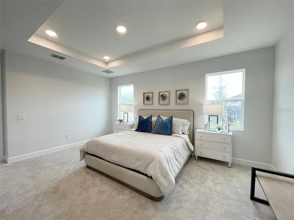 a view of an house with backyard space and balcony