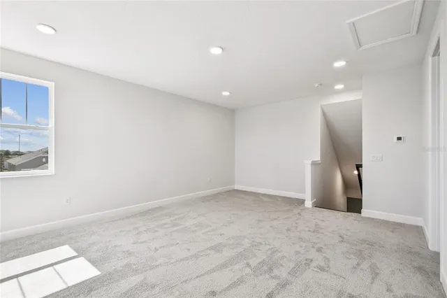 a bathroom with a sink shower and a mirror