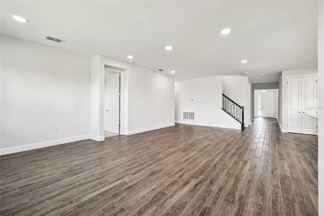 a view of an empty room with glass door