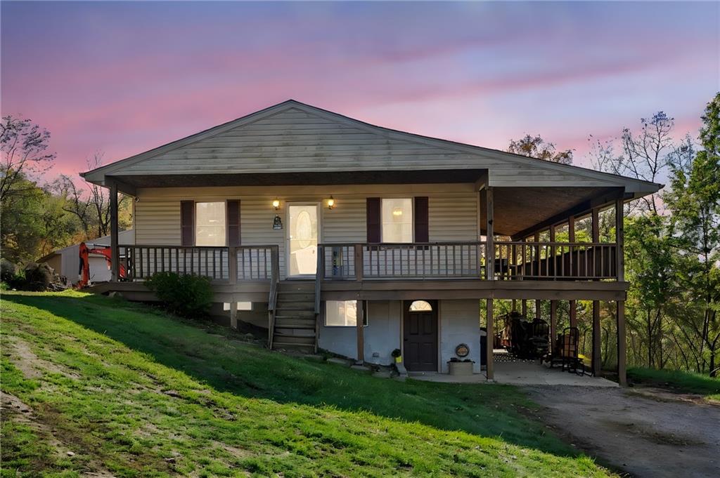 573 Shaffer Road Hookstown, PA 15050 - Photo 1 of 41 a front view of a house with a yard