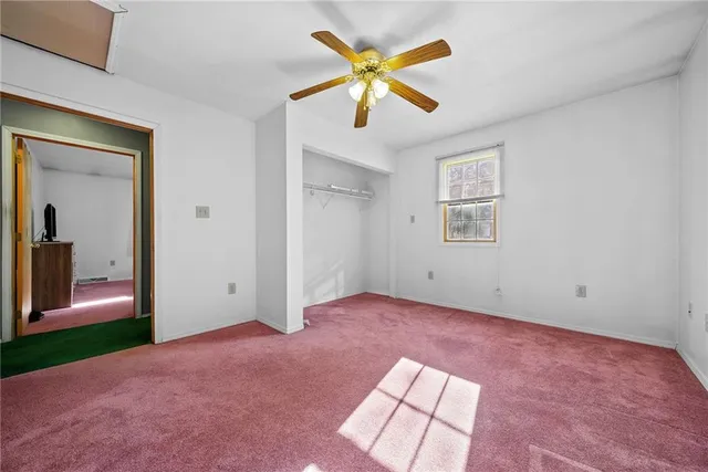 a view of an empty room and window