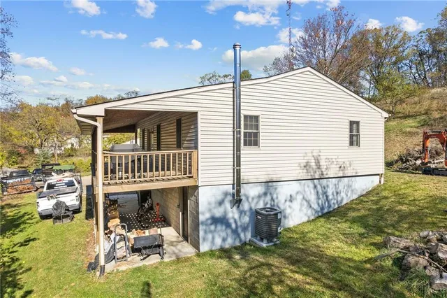 a view of a house with wooden fence