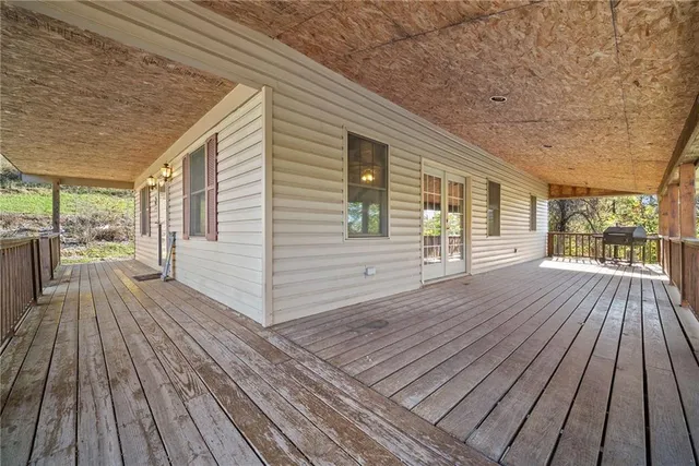 a view of outdoor space with wooden floor
