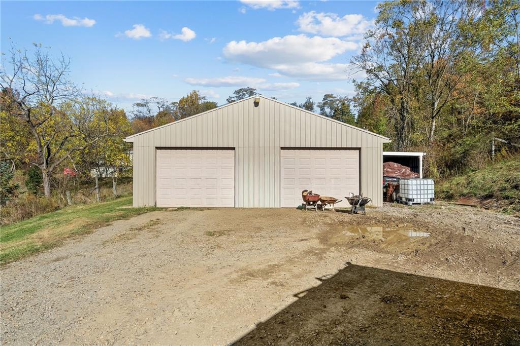 573 Shaffer Road Hookstown, PA 15050 - Photo 32 of 41 a view of large house with a outdoor space and trees around