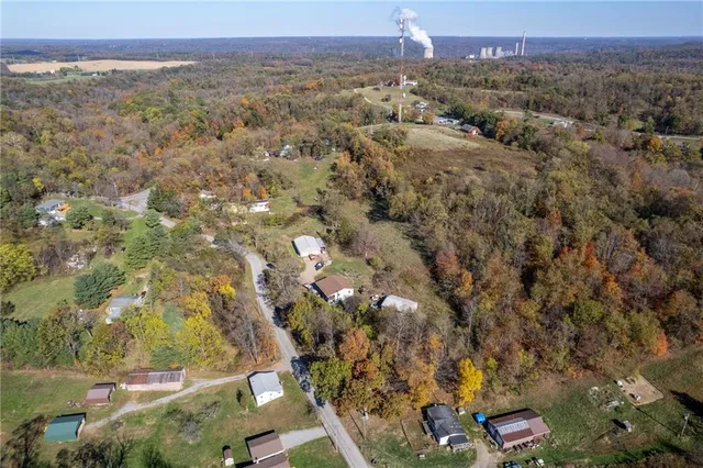 an aerial view of house with yard