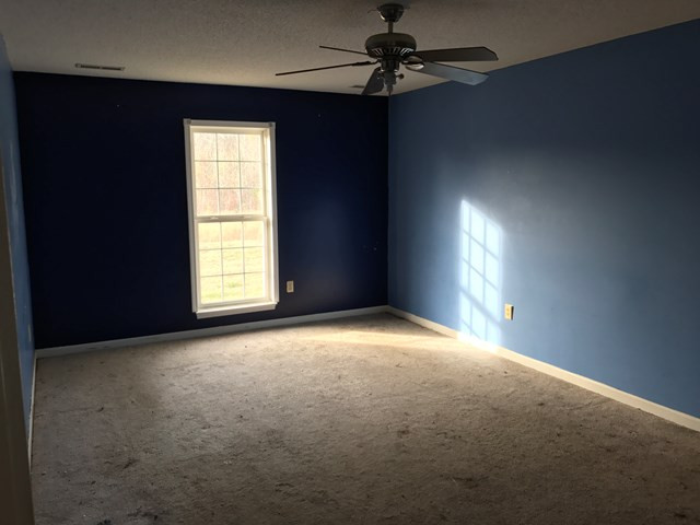 2604 County Line Road West Bradley, SC 29819 - Photo 3 of 15 an empty room with windows and fan