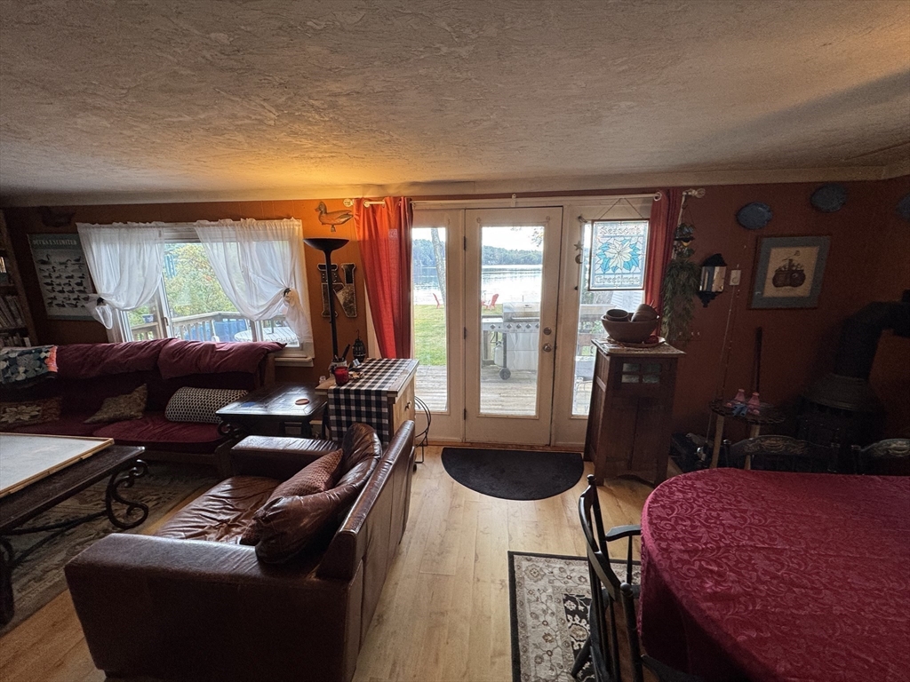 116 Brookfield Road Brimfield, MA 01010 - Photo 14 of 26 a living room with furniture a rug and a flat screen tv