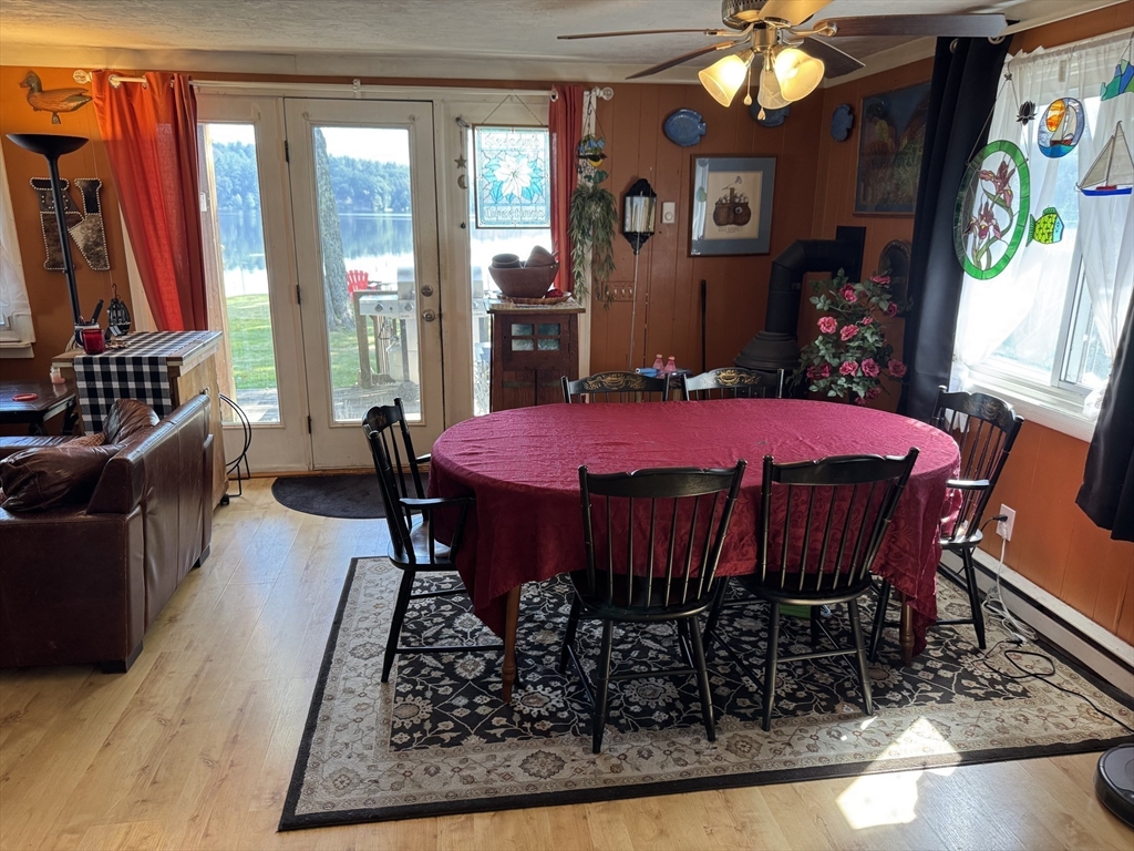 116 Brookfield Road Brimfield, MA 01010 - Photo 16 of 26 a view of a dining room with furniture a chandelier and wooden floor