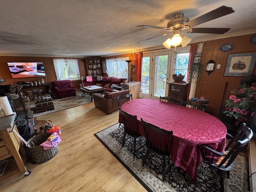 116 Brookfield Road Brimfield, MA 01010 - Photo 17 of 26 a living room with furniture a rug and a flat screen tv