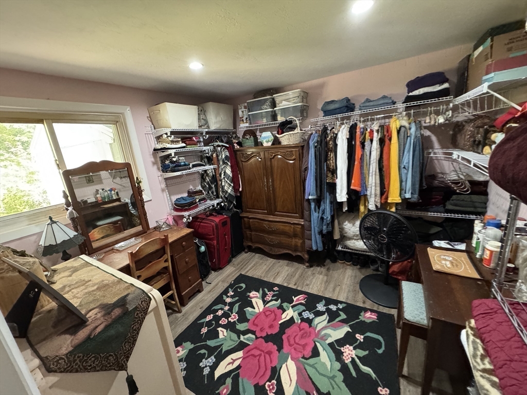 116 Brookfield Road Brimfield, MA 01010 - Photo 23 of 26 a view of walk in closet with clothes and shoes