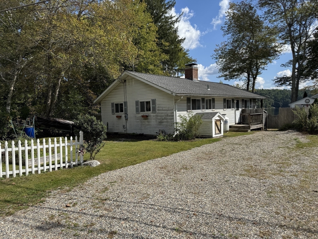 116 Brookfield Road Brimfield, MA 01010 - Photo 25 of 26 a view of a house with a yard and fence