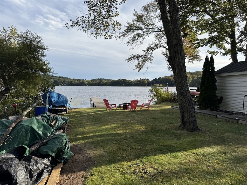 116 Brookfield Road Brimfield, MA 01010 - Photo 6 of 26 a view of a lake with a yard and large trees