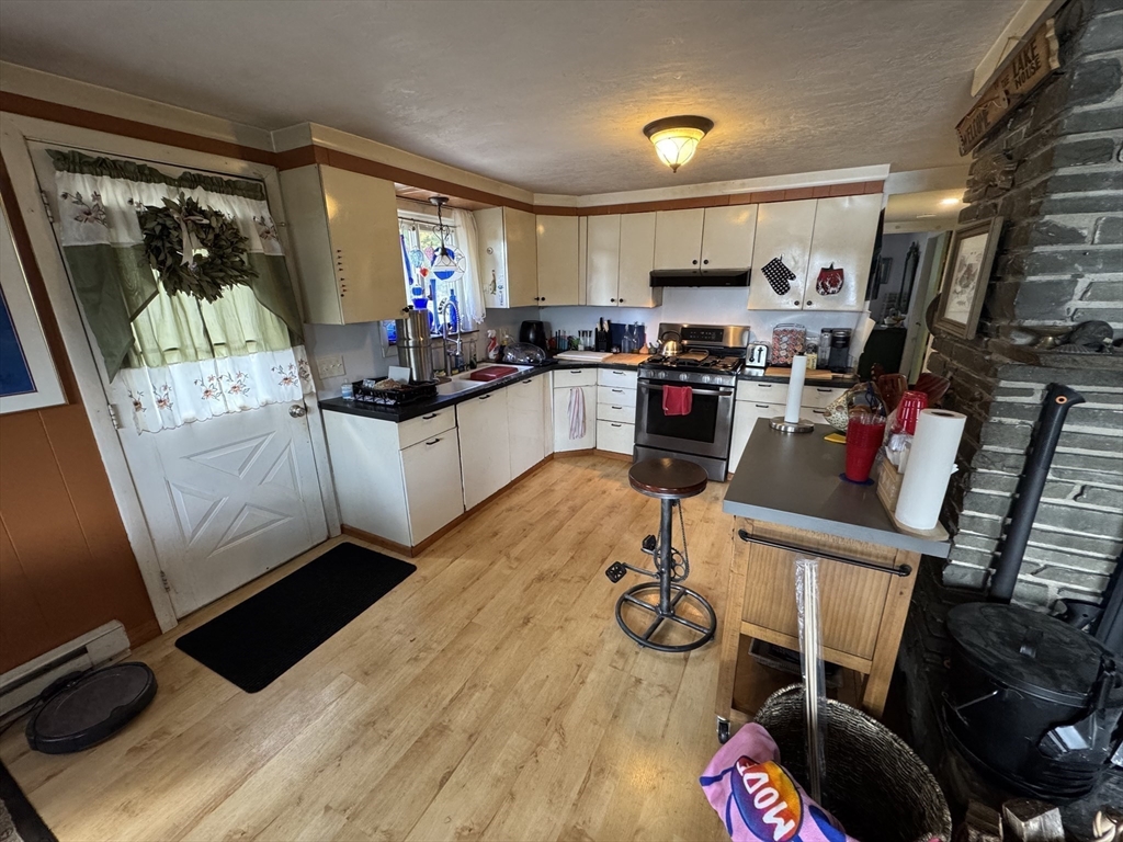 116 Brookfield Road Brimfield, MA 01010 - Photo 8 of 26 a kitchen with a sink appliances and cabinets
