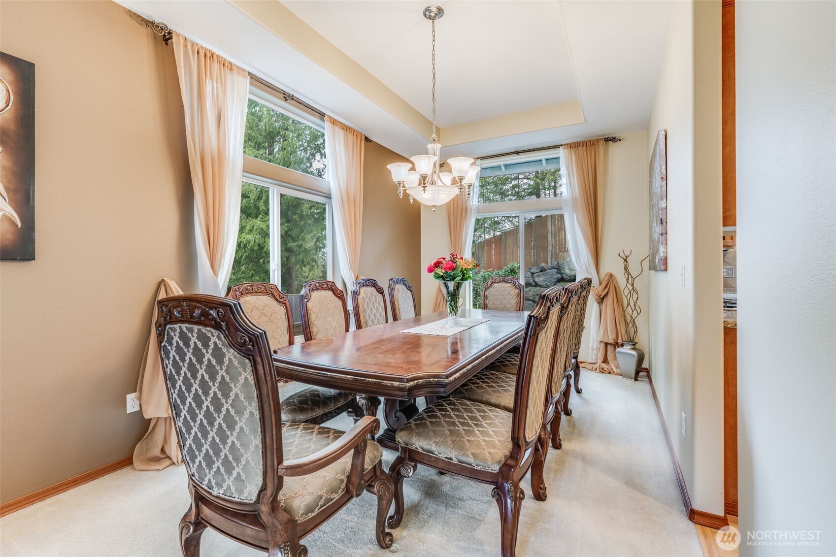 18615 13th Drive Southeast Bothell, WA 98012 - Photo 11 of 38 a dining room with furniture a chandelier and wooden floor