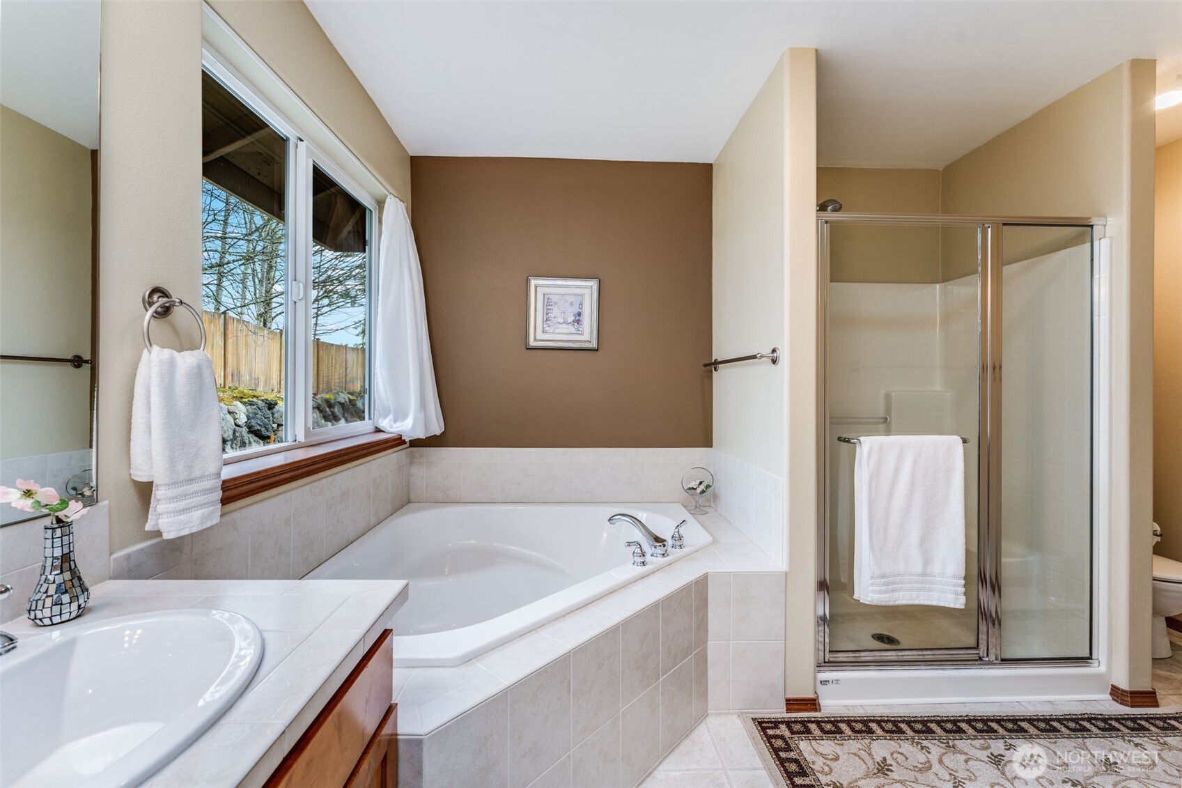 18615 13th Drive Southeast Bothell, WA 98012 - Photo 16 of 38 a bathroom with a tub and a sink