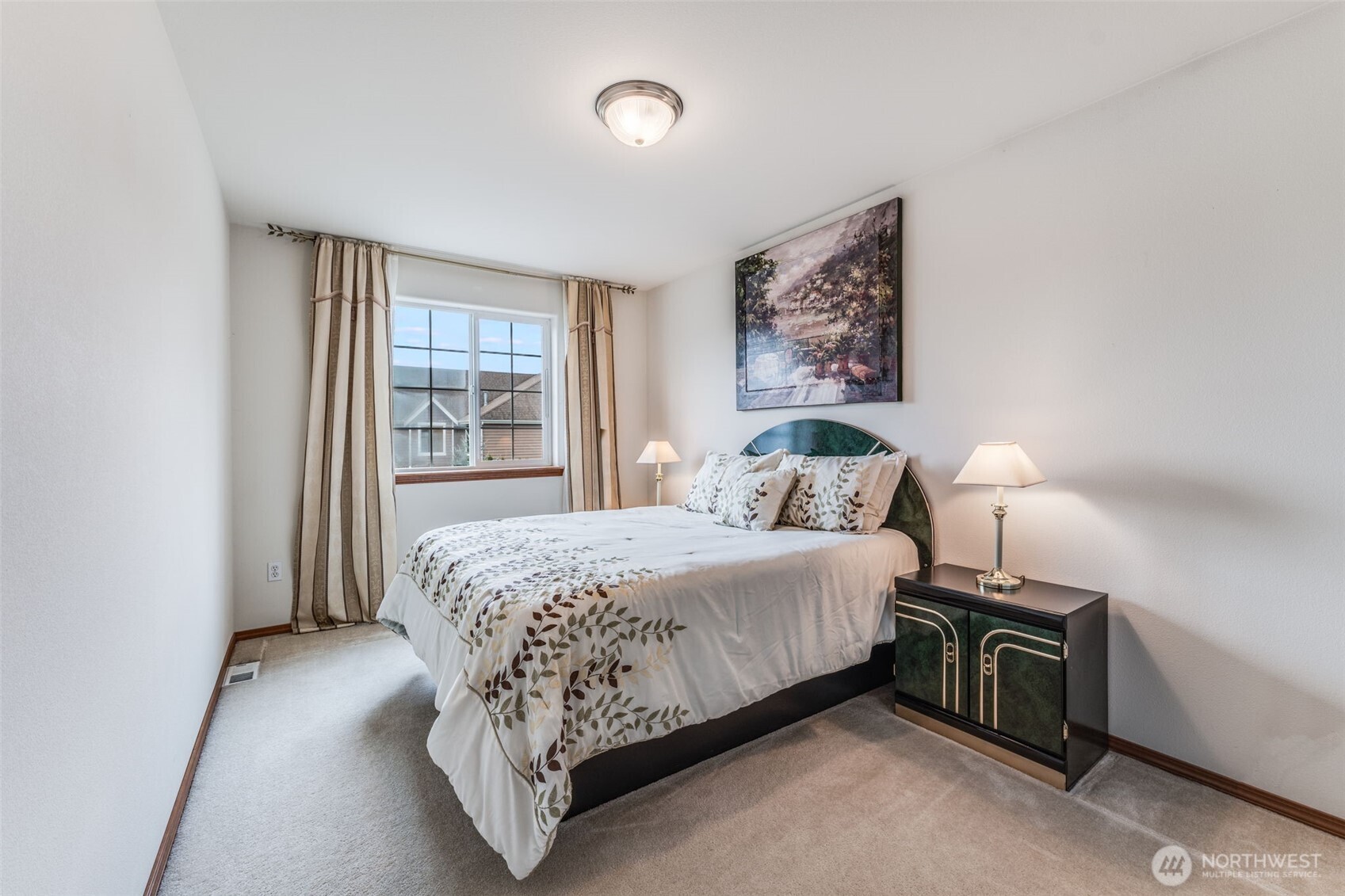 18615 13th Drive Southeast Bothell, WA 98012 - Photo 18 of 38 a bedroom with a bed and a lamp