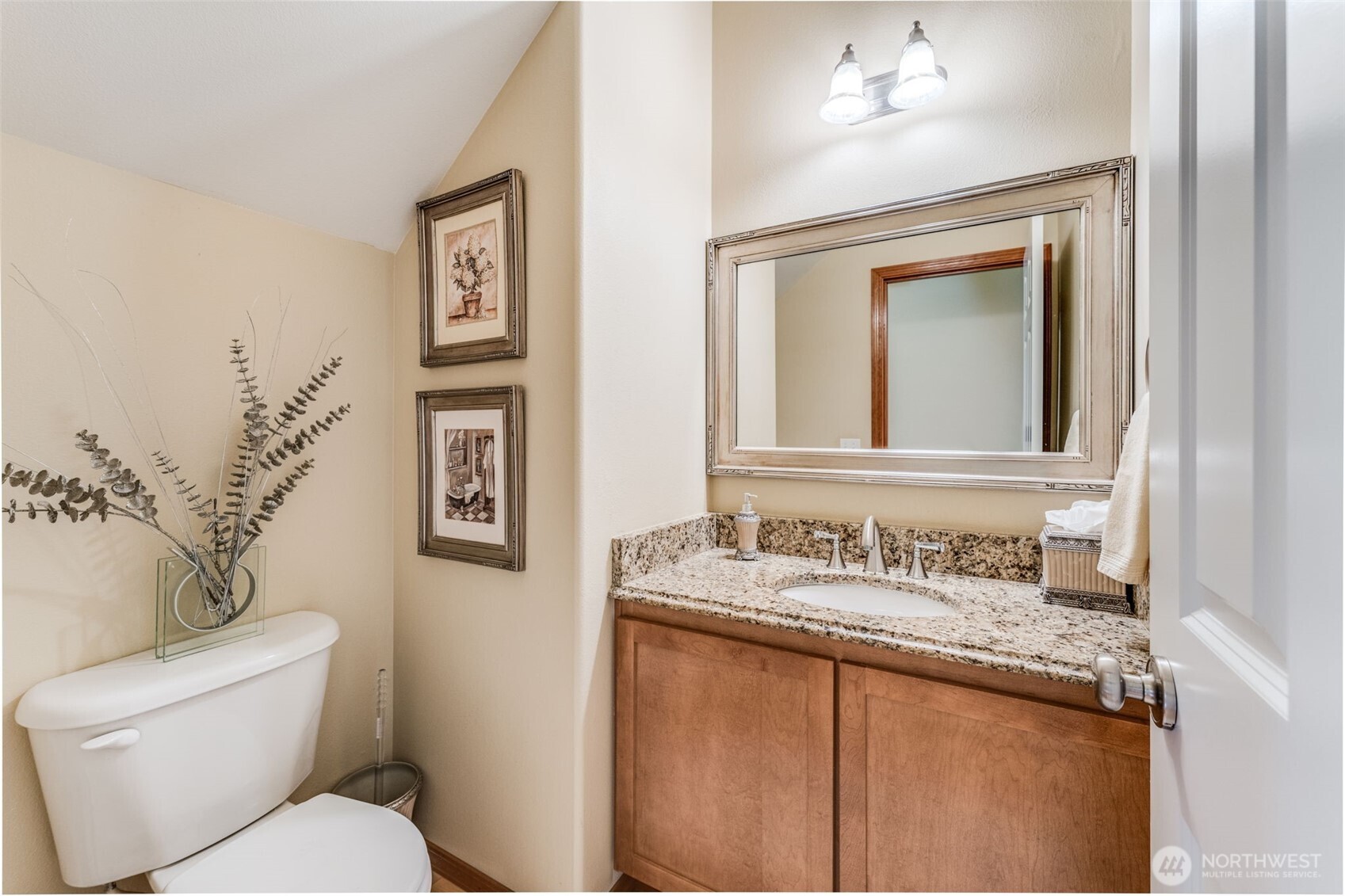 18615 13th Drive Southeast Bothell, WA 98012 - Photo 19 of 38 a bathroom with a granite countertop toilet sink and mirror