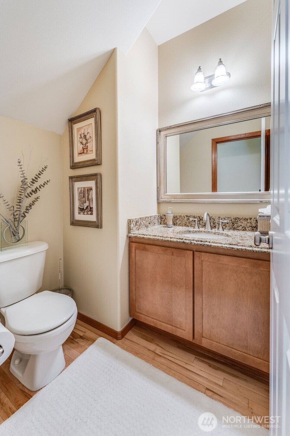 18615 13th Drive Southeast Bothell, WA 98012 - Photo 20 of 38 a bathroom with a granite countertop toilet sink and mirror