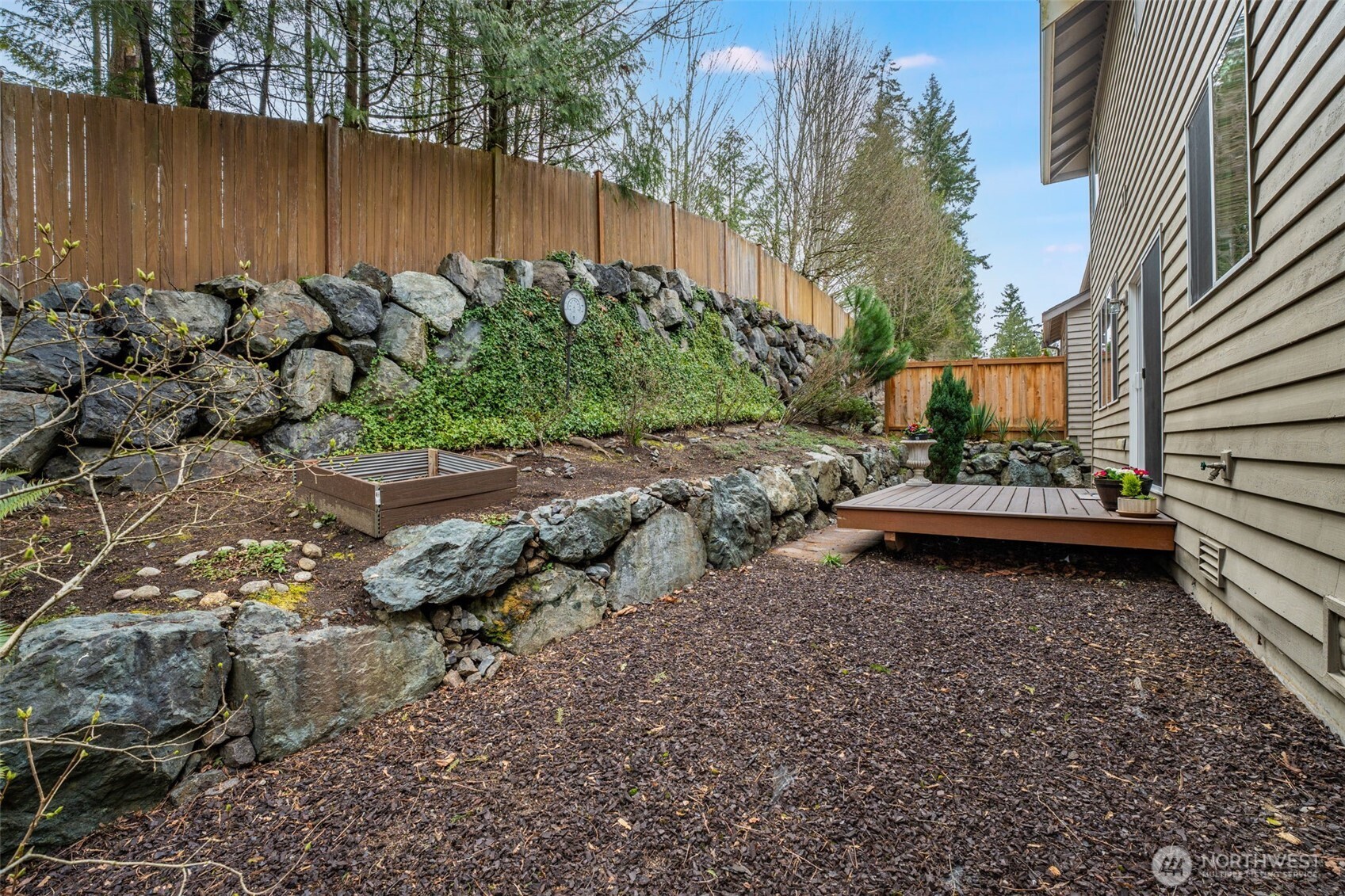 18615 13th Drive Southeast Bothell, WA 98012 - Photo 35 of 38 a view of a backyard with plants and outdoor seating
