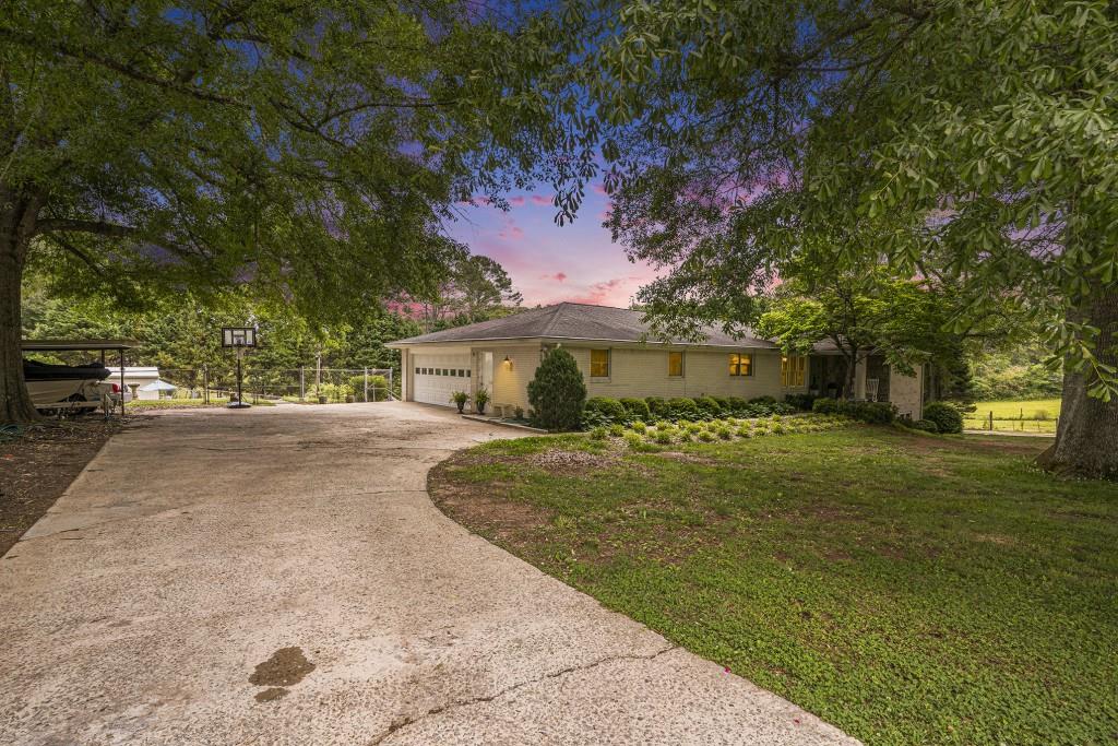 143 Rustic Road Stockbridge, GA 30281 - Photo 1 of 1 a front view of a house with a yard and a garage