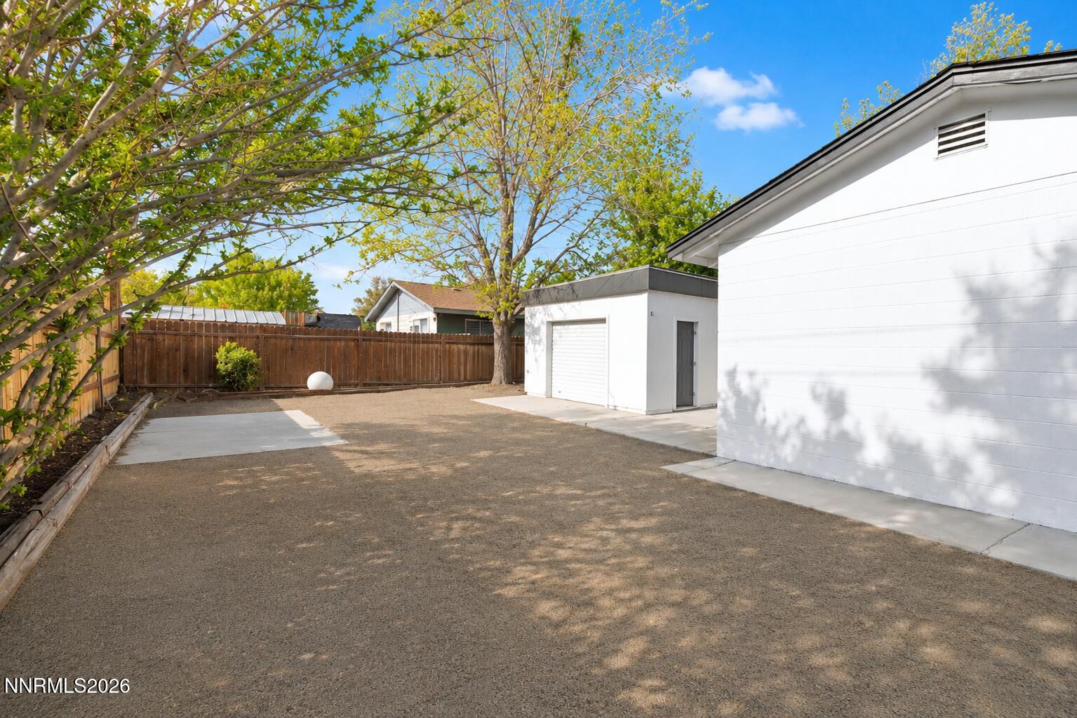 742 Ruth Street Carson City, NV 89701 - Photo 24 of 25 a view of a yard with a tree