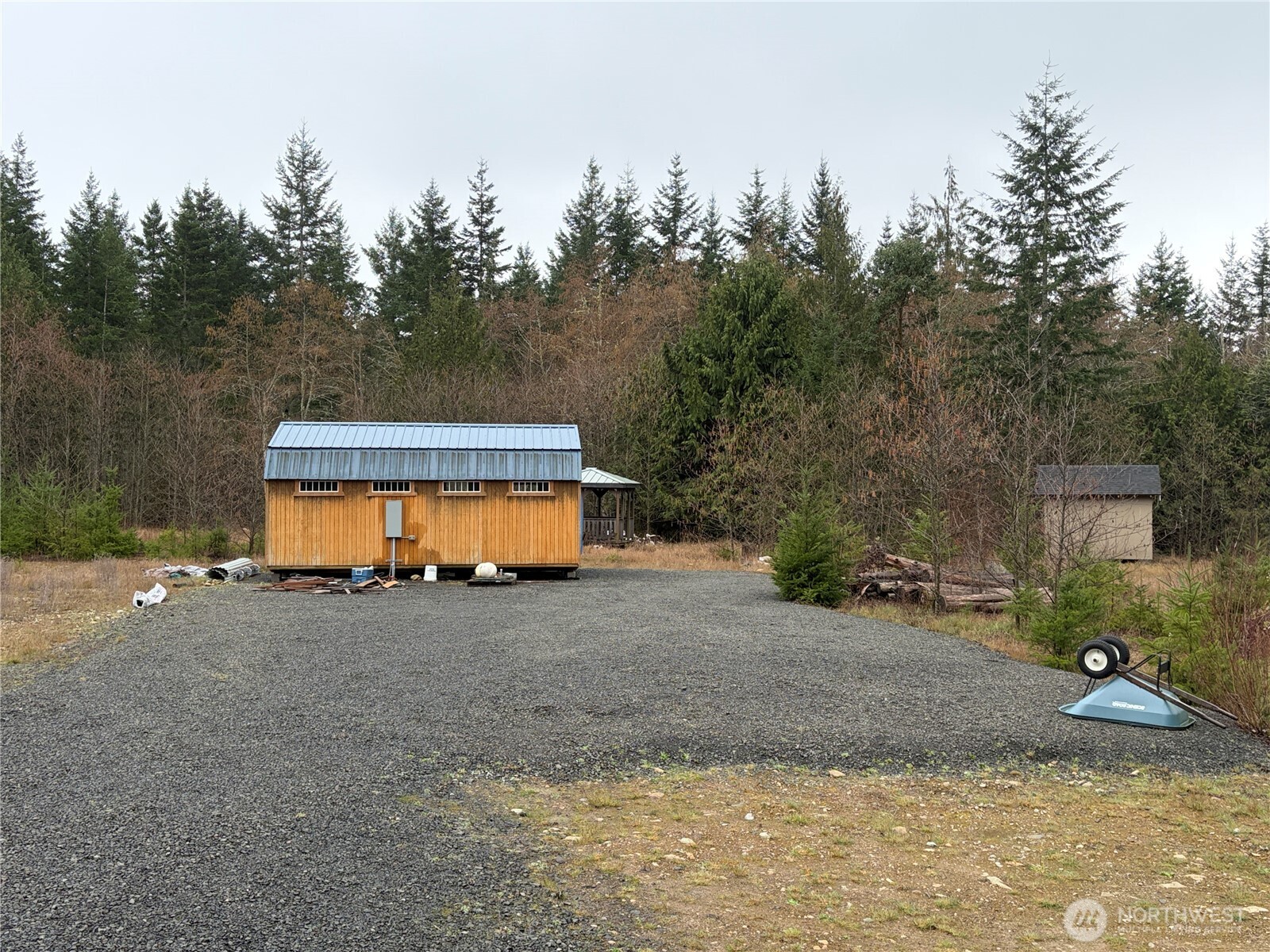 a view of a house with a yard and a tree